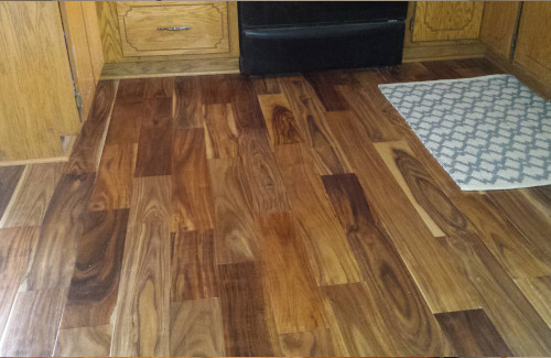 Natural wood flooring installed in a kitchen