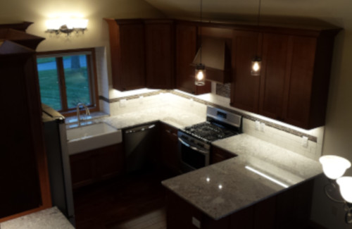 Kitchen remodel with dark wood cabinets, stone countertops, and peninsula
