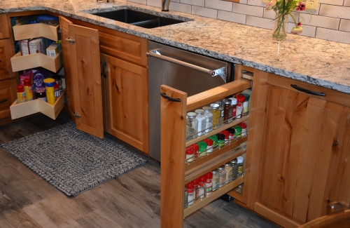 Custom kitchen cabinets with pull-out storage and granite countertops